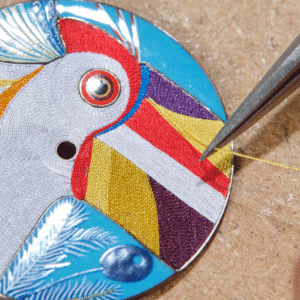 how hermes handcrafts the intricate dial of its new limited edition toucan watch